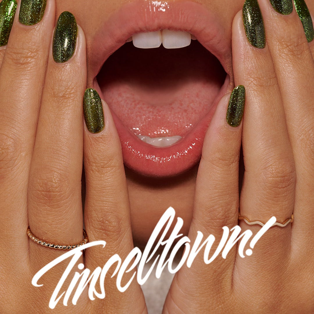 Close-up of a person's hands with green nail polish and a mouth with red lipstick, featuring 'Tinseltown' and 'The Gelbottle Inc.' text.